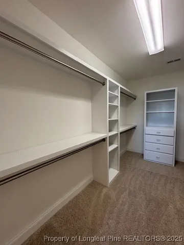 a view of an empty walk in closet