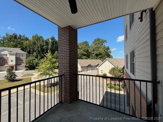 a view of a balcony with a pot
