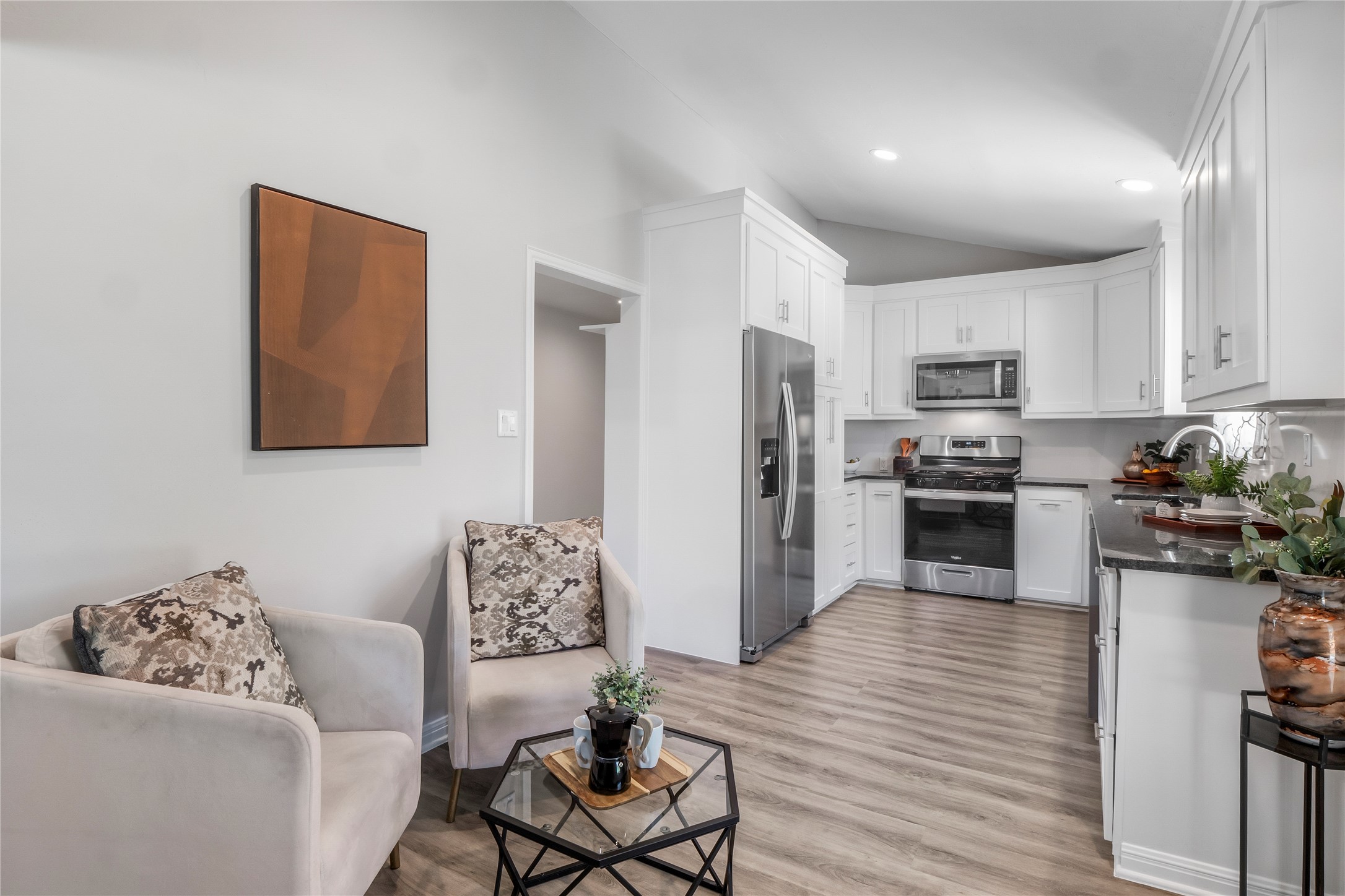 8007 Colony Loop Drive Austin, TX 78724 - Photo 7 of 40 Flexible breakfast or lounge nook with open sightlines to the kitchen and backyard — an easy everyday gathering spot.