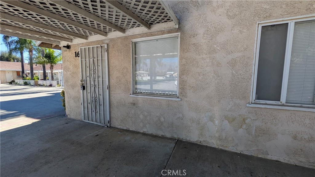 845 East 6th Street, Unit 16 Beaumont, CA 92223 - Photo 1 of 14 a view of livingroom with hardwood floor and a hallway