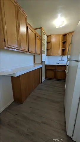 a room with lots of wooden cabinets