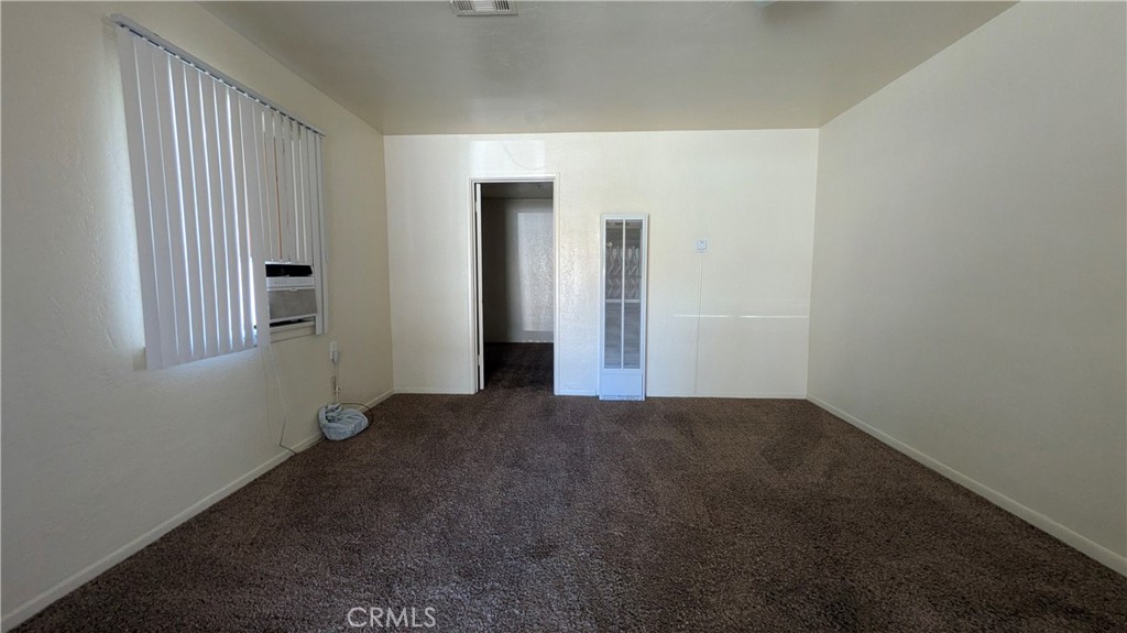 845 East 6th Street, Unit 16 Beaumont, CA 92223 - Photo 7 of 14 an empty room with windows