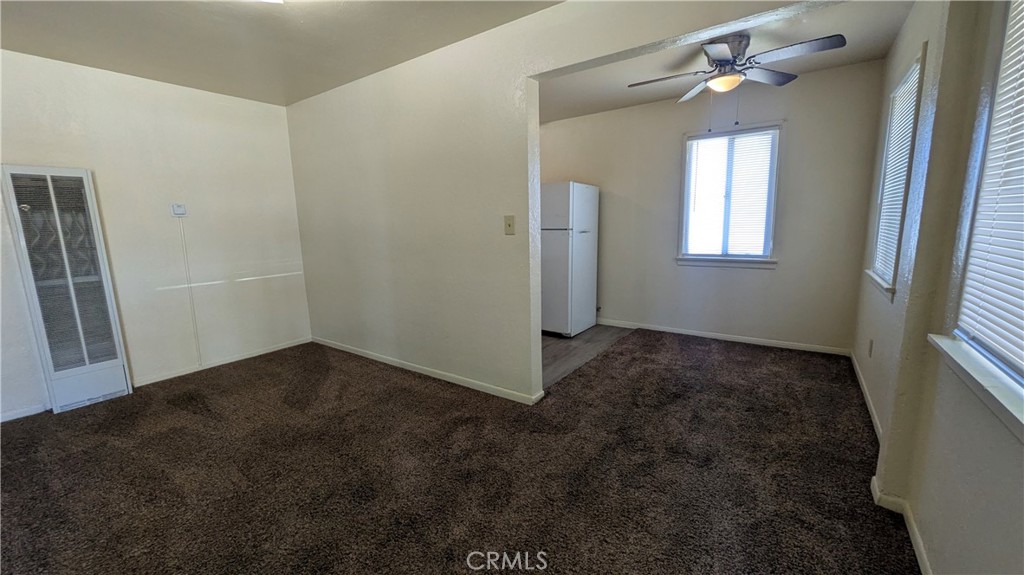 845 East 6th Street, Unit 16 Beaumont, CA 92223 - Photo 8 of 14 wooden floor in an empty room with a window