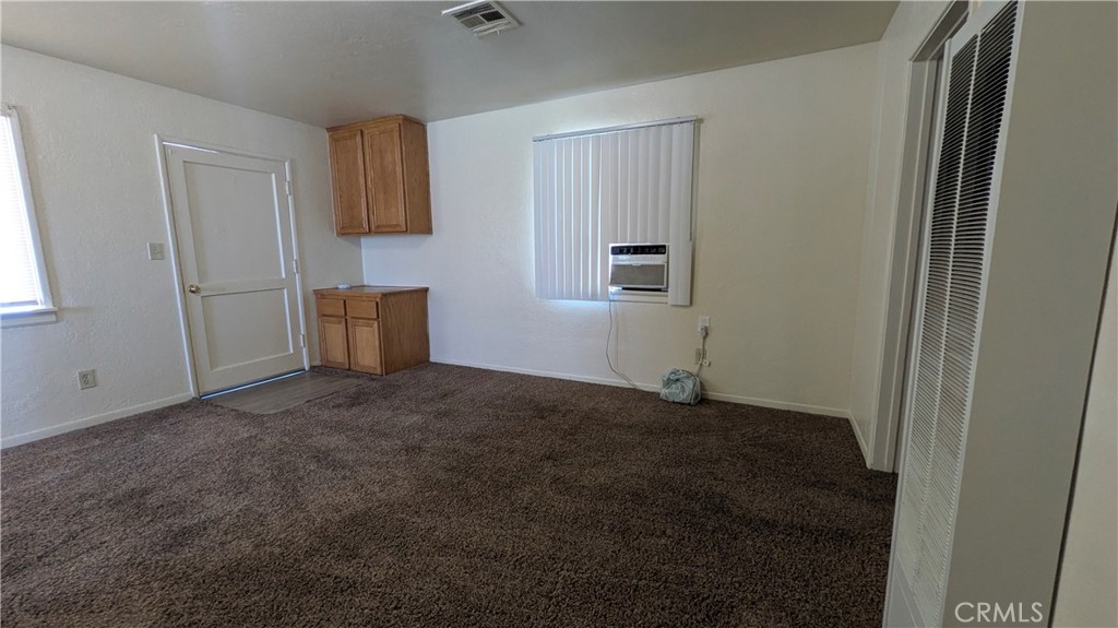 845 East 6th Street, Unit 16 Beaumont, CA 92223 - Photo 9 of 14 a view of a room that has a window