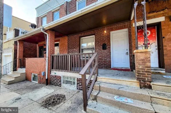 a view of a house with wooden stairs
