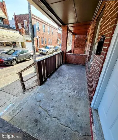 a view of a porch with furniture