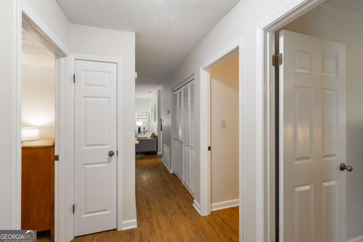 168 Pearl Street Athens, GA 30601 - Photo 15 of 43 a view of a hallway with wooden floor and closet area