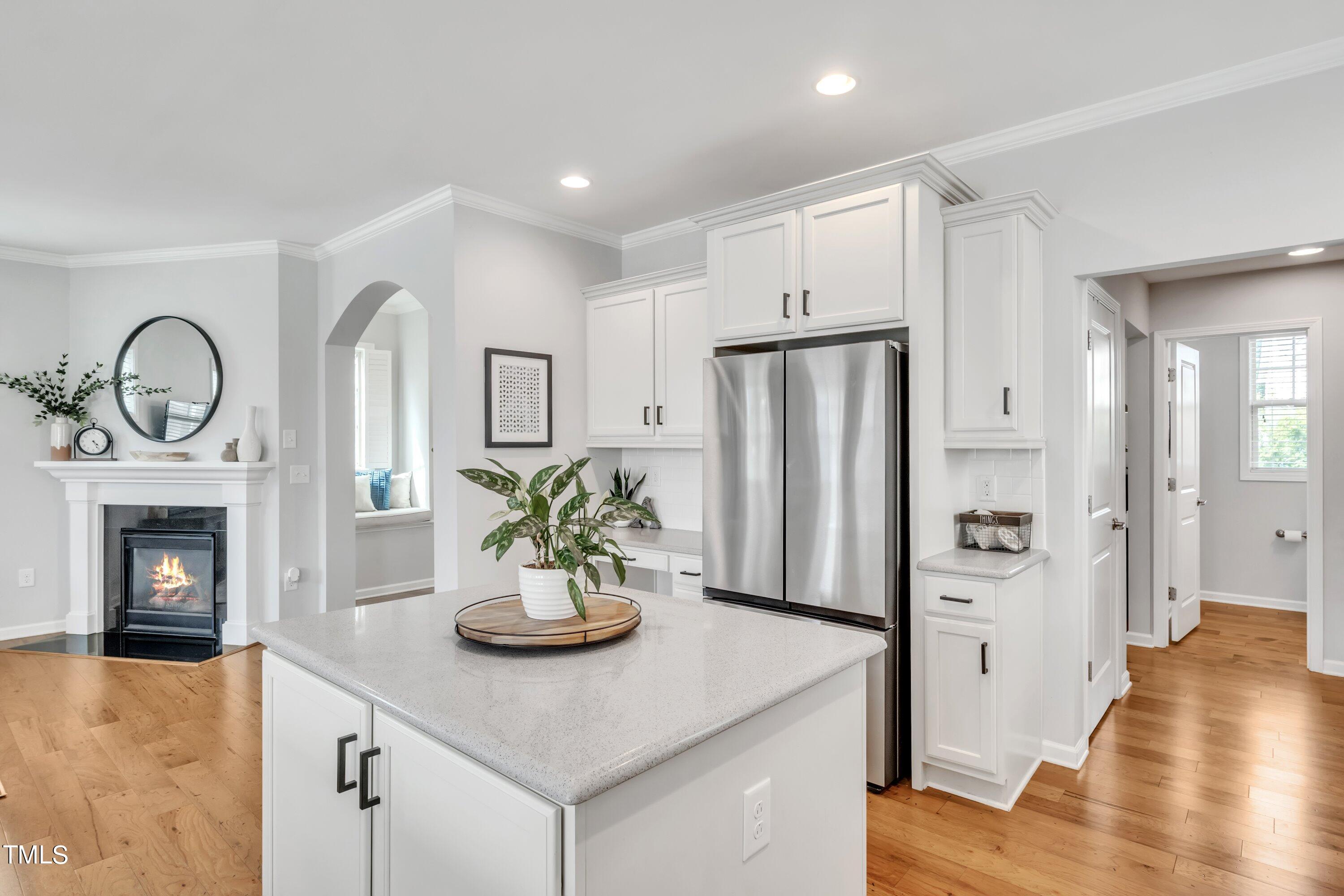 844 Wildflower Ridge Road Wake Forest, NC 27587 - Photo 20 of 66 a kitchen with a refrigerator and a stove