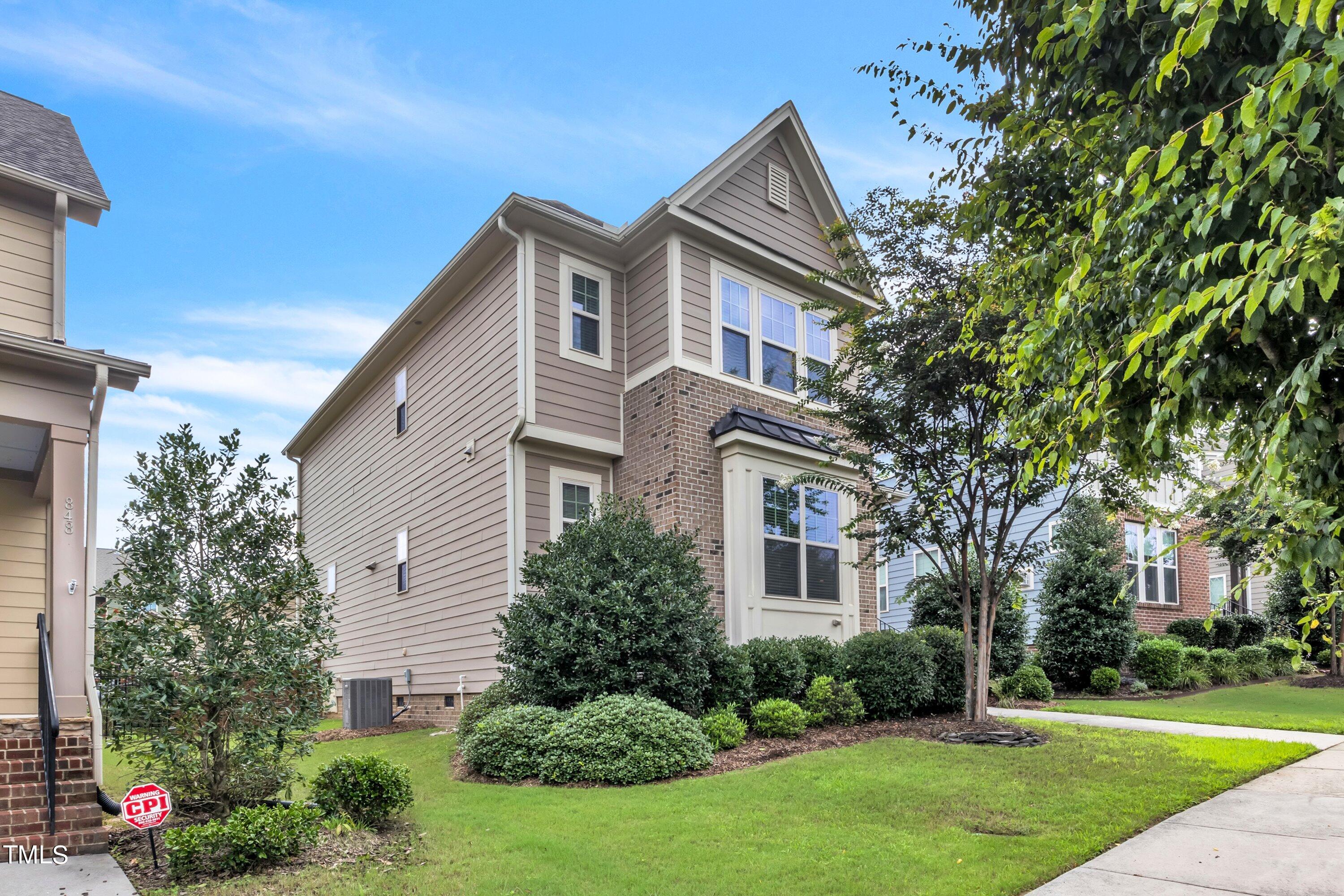 844 Wildflower Ridge Road Wake Forest, NC 27587 - Photo 29 of 66 a front view of a house with a yard