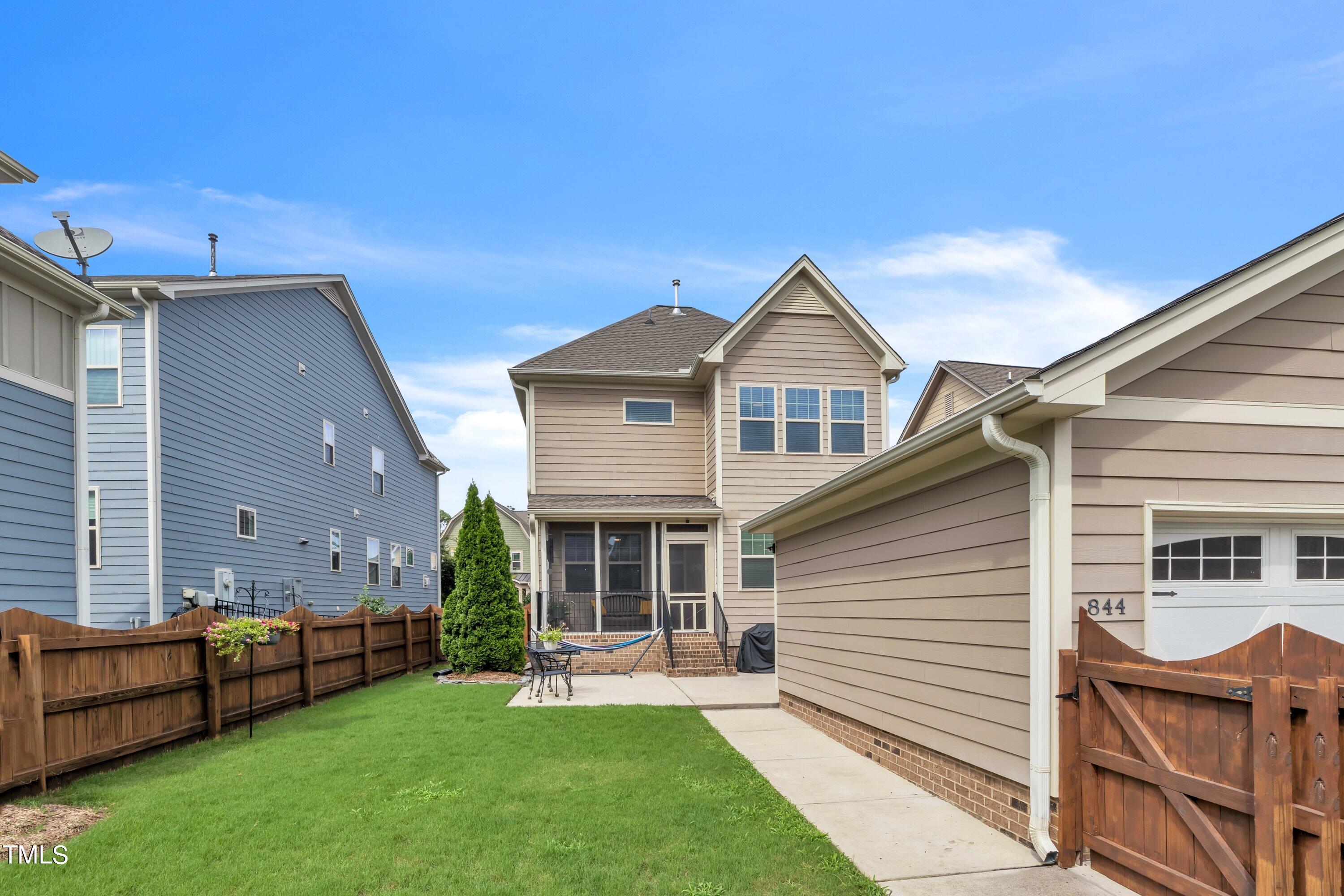 844 Wildflower Ridge Road Wake Forest, NC 27587 - Photo 3 of 66 a front view of a house with a garden and yard