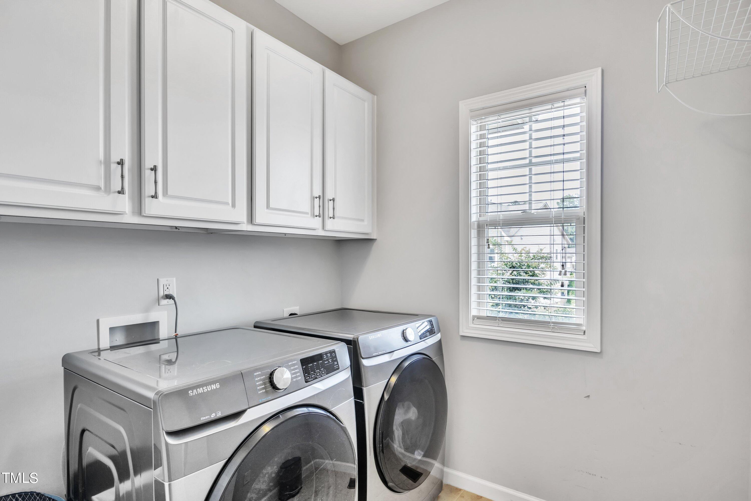 844 Wildflower Ridge Road Wake Forest, NC 27587 - Photo 33 of 66 a utility room with dryer and washer