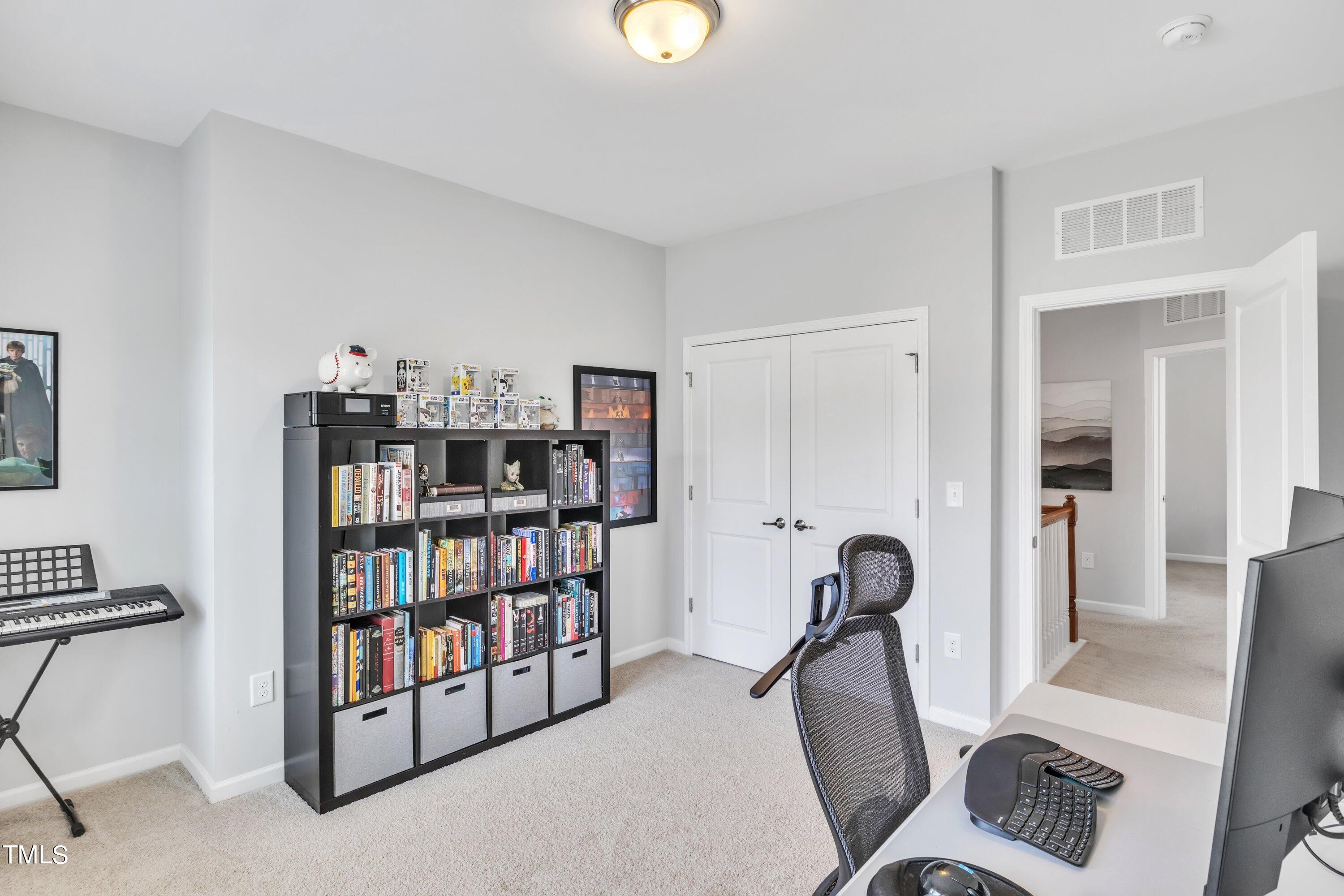 844 Wildflower Ridge Road Wake Forest, NC 27587 - Photo 36 of 66 a view of a workspace with furniture and bedroom view