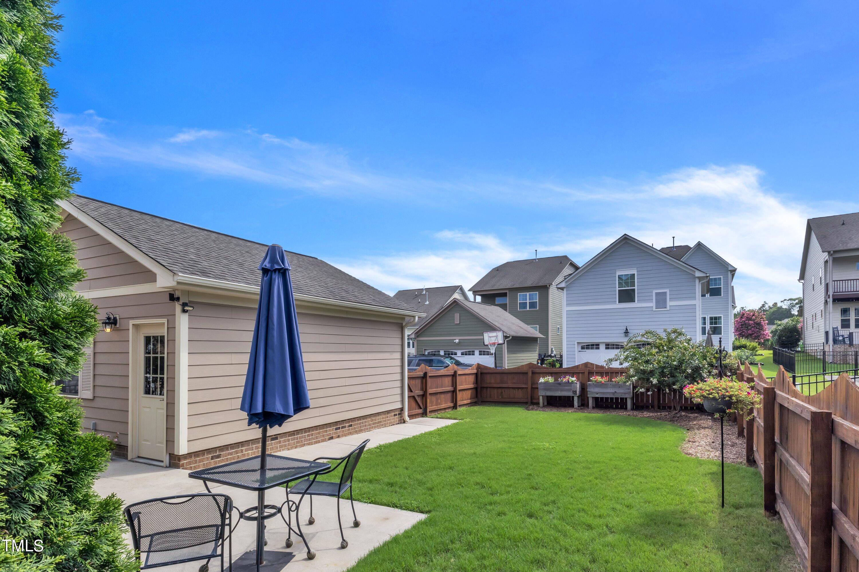 844 Wildflower Ridge Road Wake Forest, NC 27587 - Photo 48 of 66 a front view of house with yard and outdoor seating