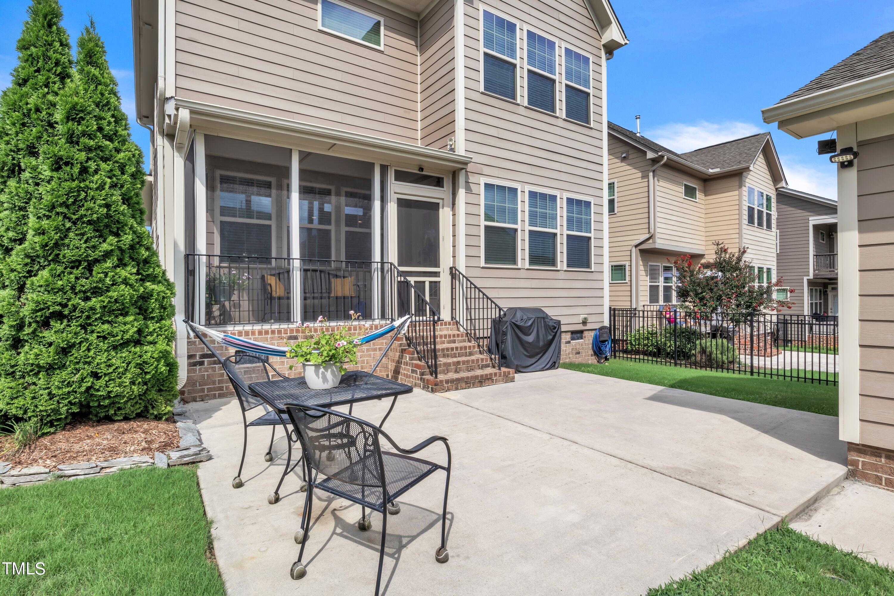 844 Wildflower Ridge Road Wake Forest, NC 27587 - Photo 49 of 66 a view of a house with backyard and sitting area