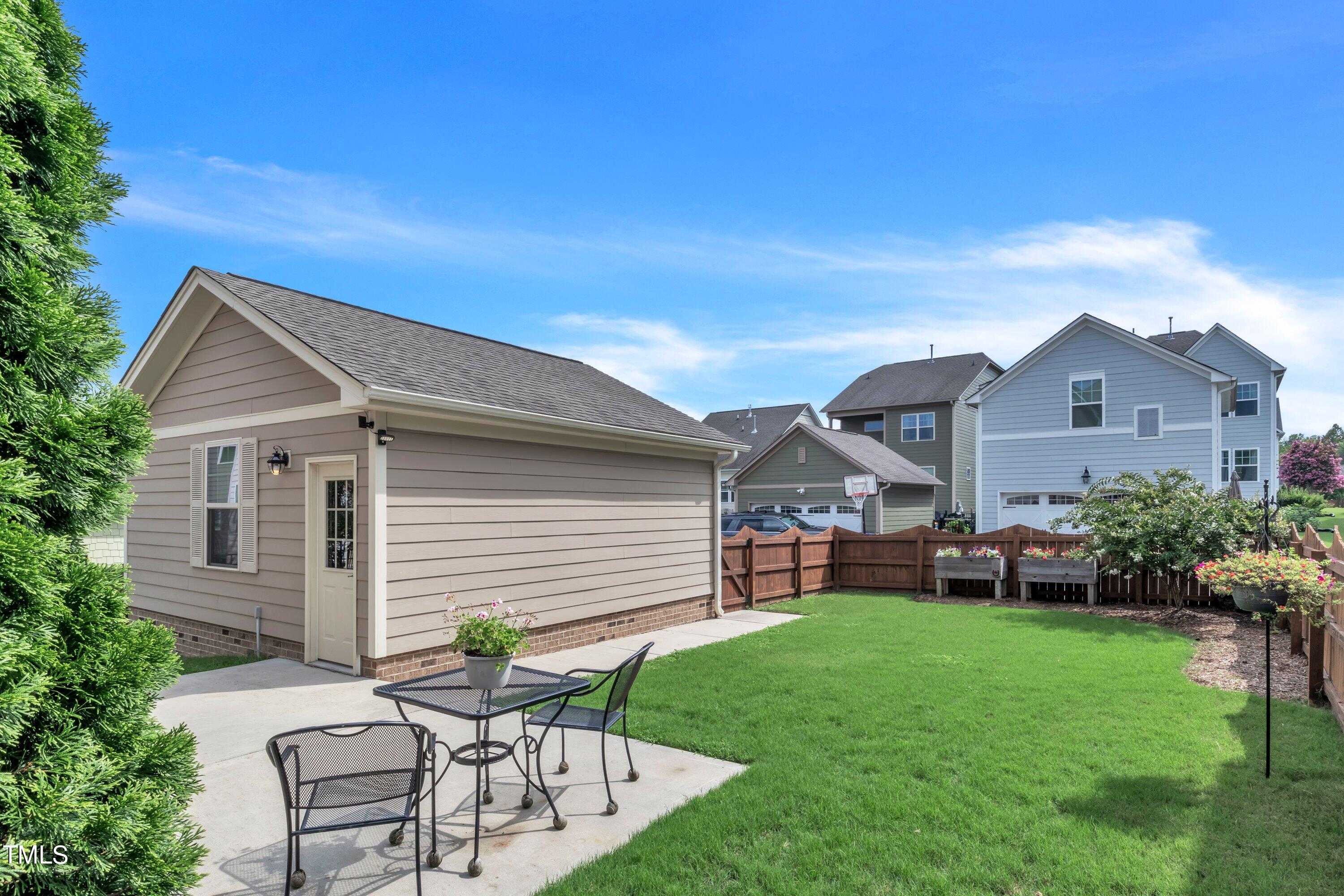 844 Wildflower Ridge Road Wake Forest, NC 27587 - Photo 54 of 66 a view of a house with a yard