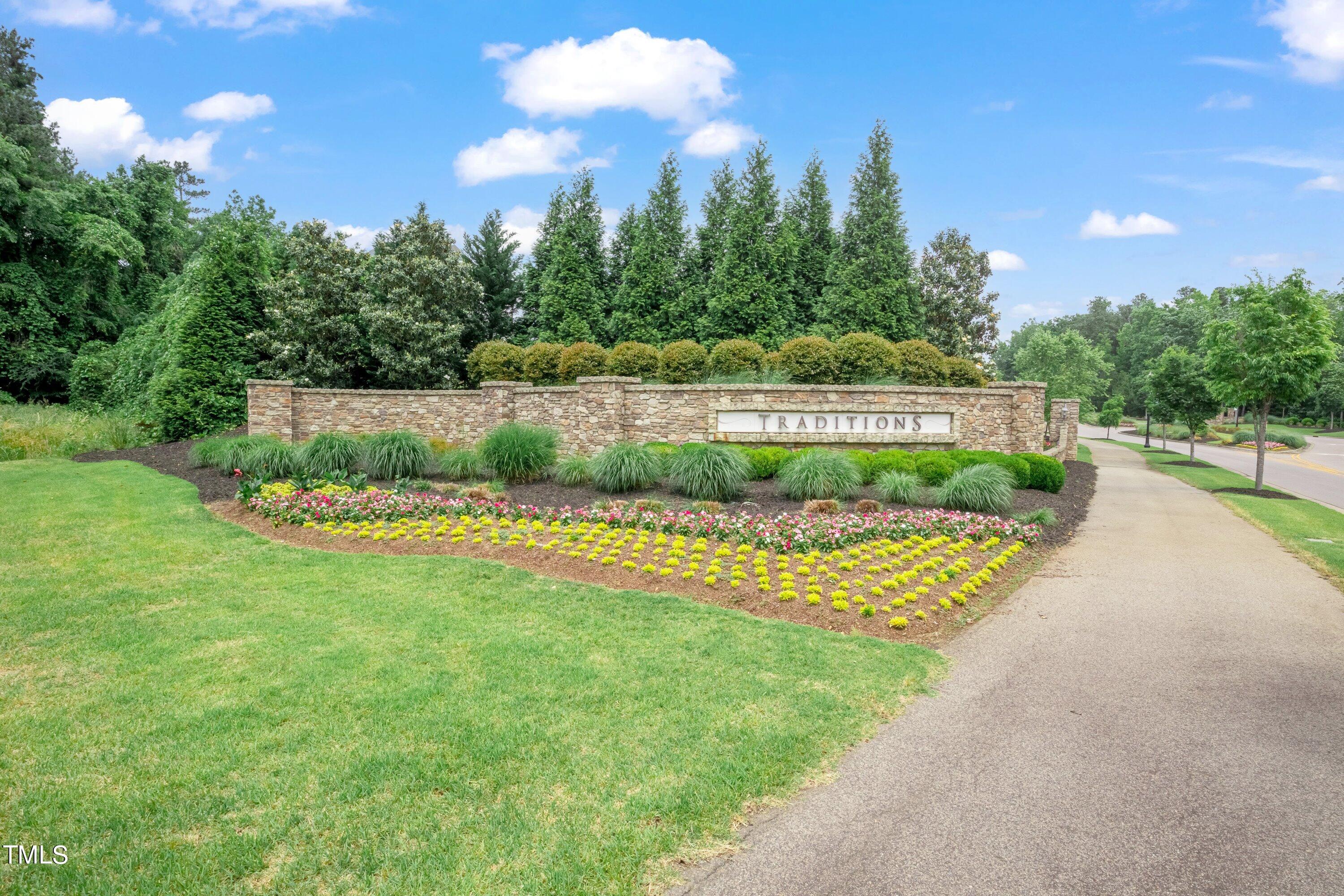 844 Wildflower Ridge Road Wake Forest, NC 27587 - Photo 56 of 66 a view of a garden with a lake view