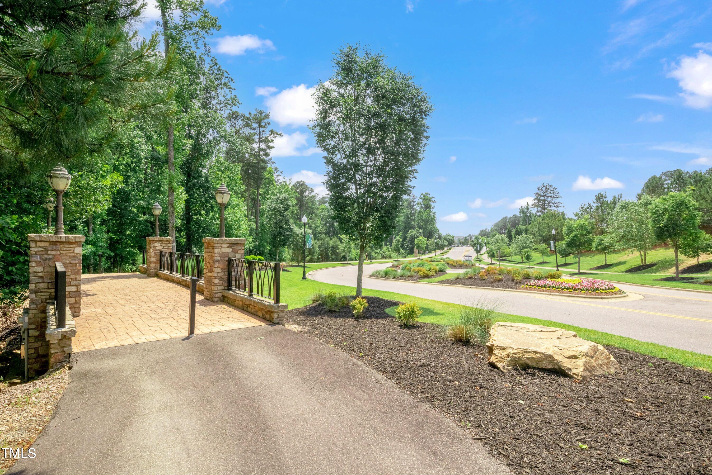 844 Wildflower Ridge Road Wake Forest, NC 27587 - Photo 60 of 66 a view of a park with swings and slides