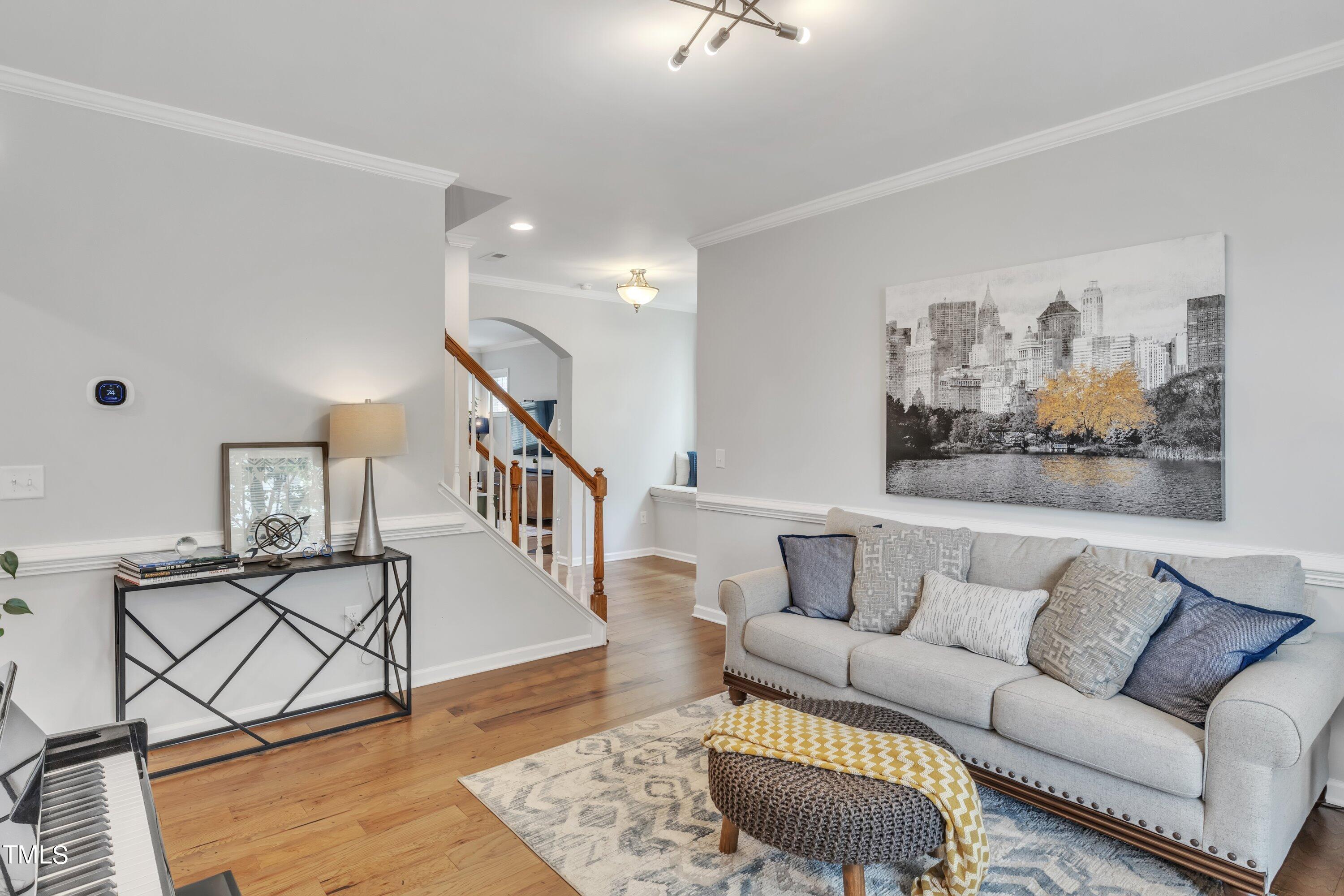 844 Wildflower Ridge Road Wake Forest, NC 27587 - Photo 10 of 66 a living room with furniture and a wooden floor