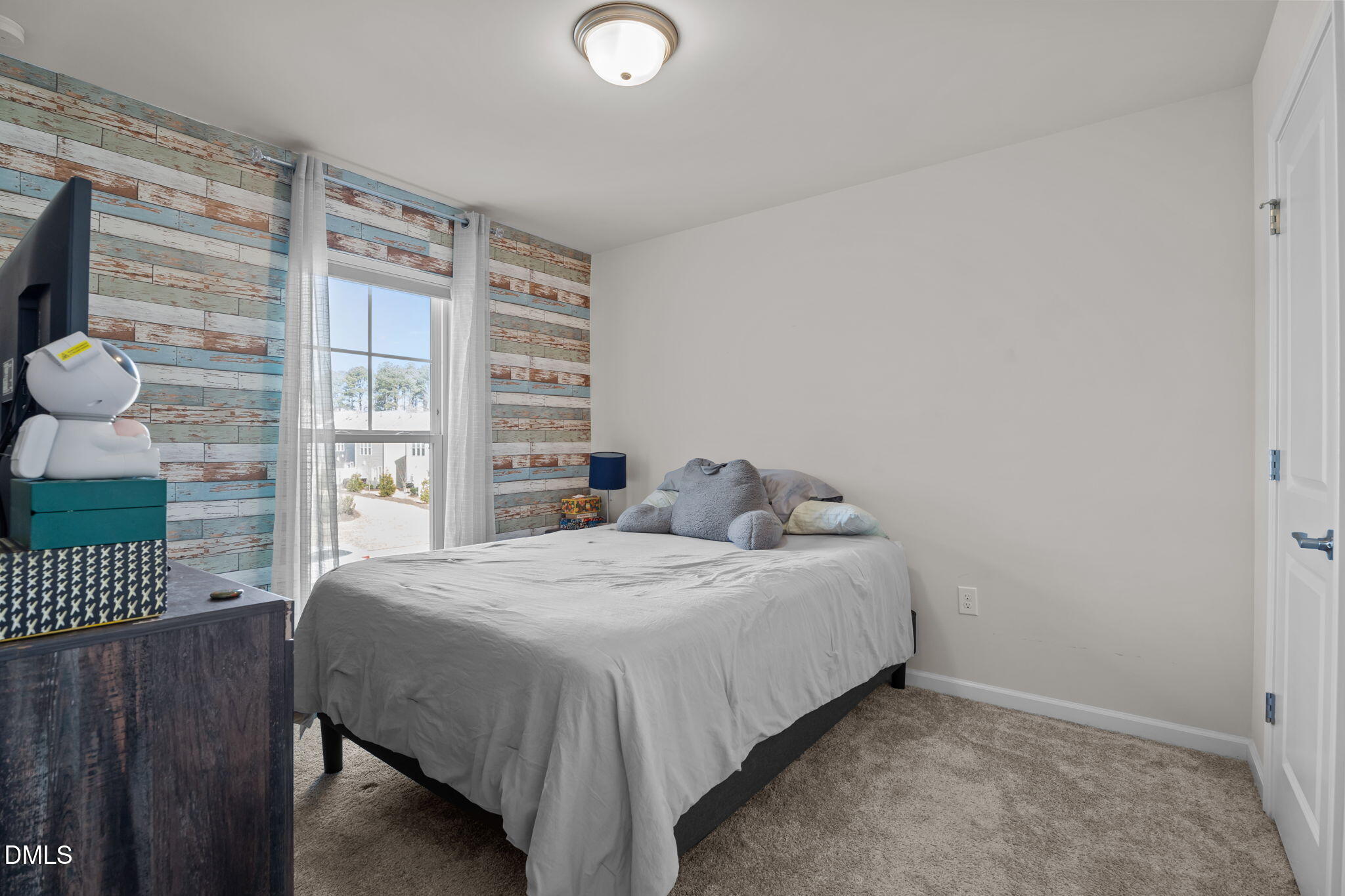 1572 Rhodes Pond Street Wendell, NC 27591 - Photo 25 of 44 a bedroom with a bed and a window
