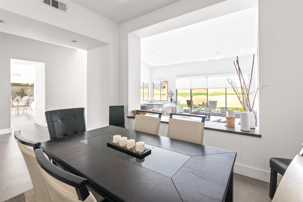 54877 Inverness Way La Quinta, CA 92253 - Photo 11 of 60 a living room with furniture and a large window