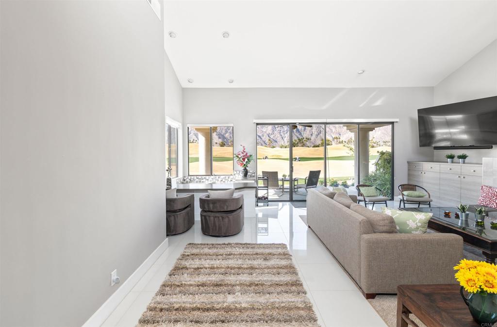 54877 Inverness Way La Quinta, CA 92253 - Photo 12 of 60 a living room with furniture and a flat screen tv