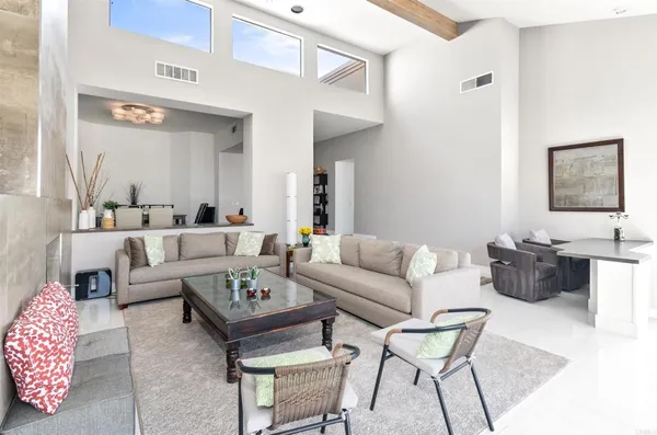 a living room with furniture and a table