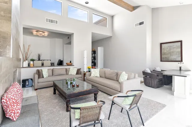 a living room with furniture and a table