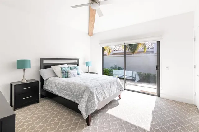 a bedroom with a bed and a lamp