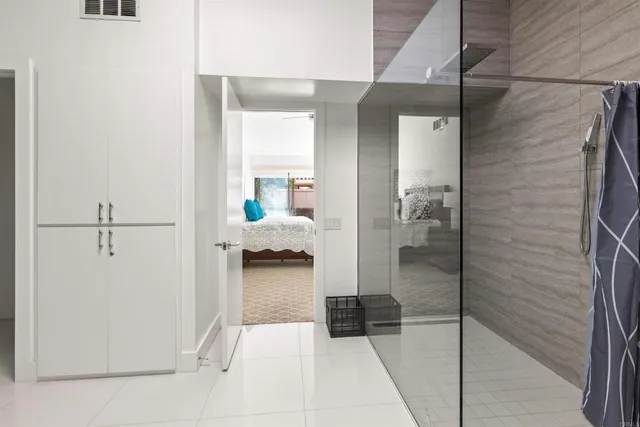 a bedroom with furniture and a window