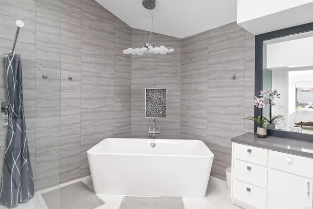 a bathroom with a granite countertop sink mirror and double