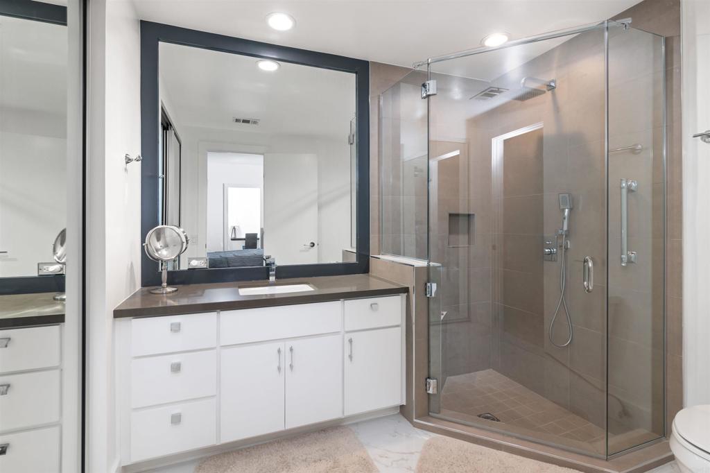 54877 Inverness Way La Quinta, CA 92253 - Photo 39 of 60 a bathroom with a granite countertop sink mirror and double