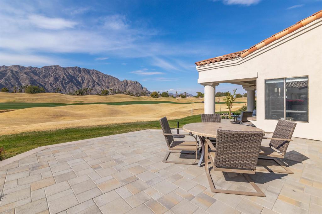 54877 Inverness Way La Quinta, CA 92253 - Photo 40 of 60 a view of a terrace with chair and table