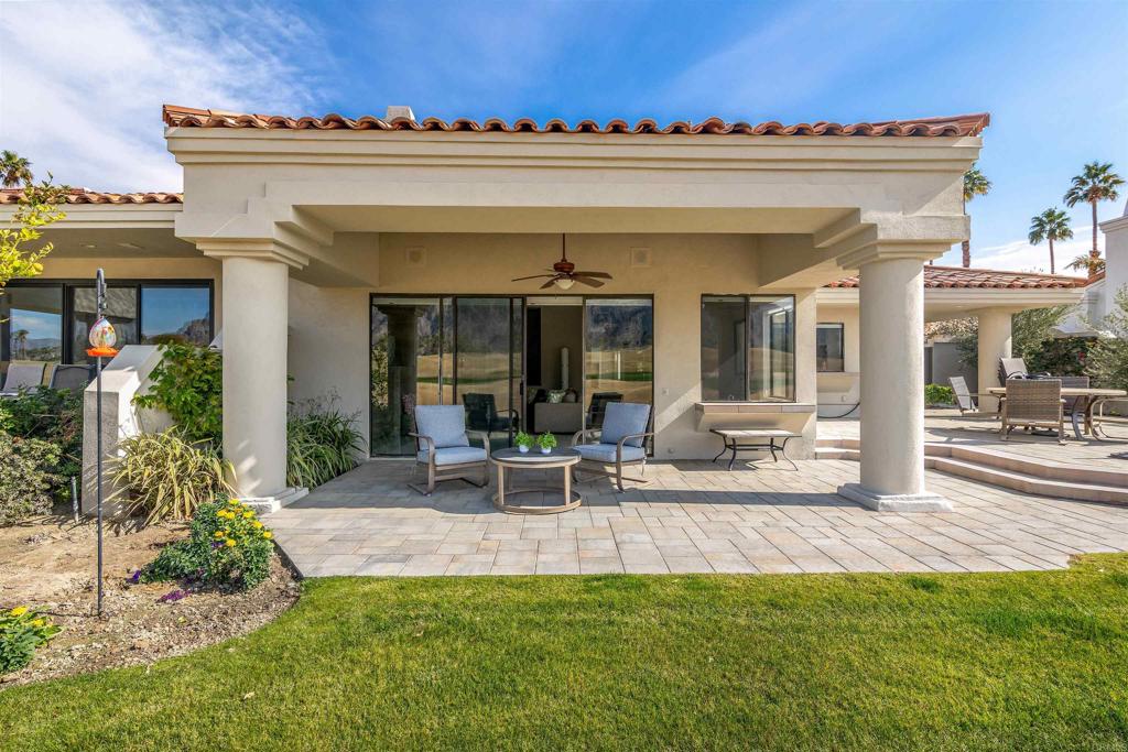 54877 Inverness Way La Quinta, CA 92253 - Photo 43 of 60 a view of a house with a porch and furniture