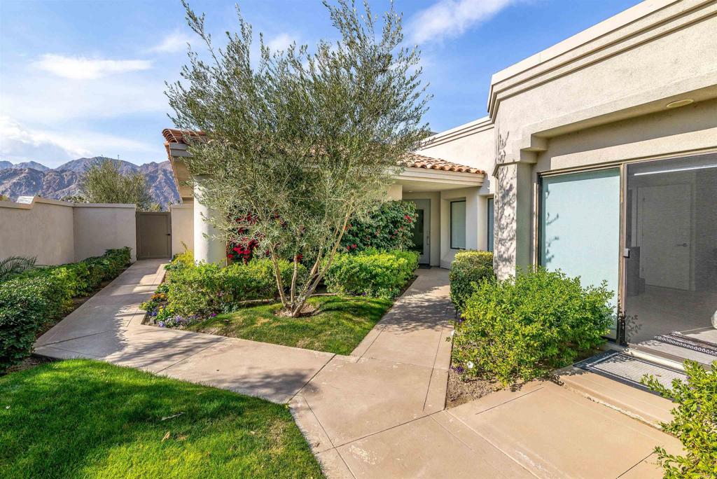 54877 Inverness Way La Quinta, CA 92253 - Photo 6 of 60 a front view of a house with garden