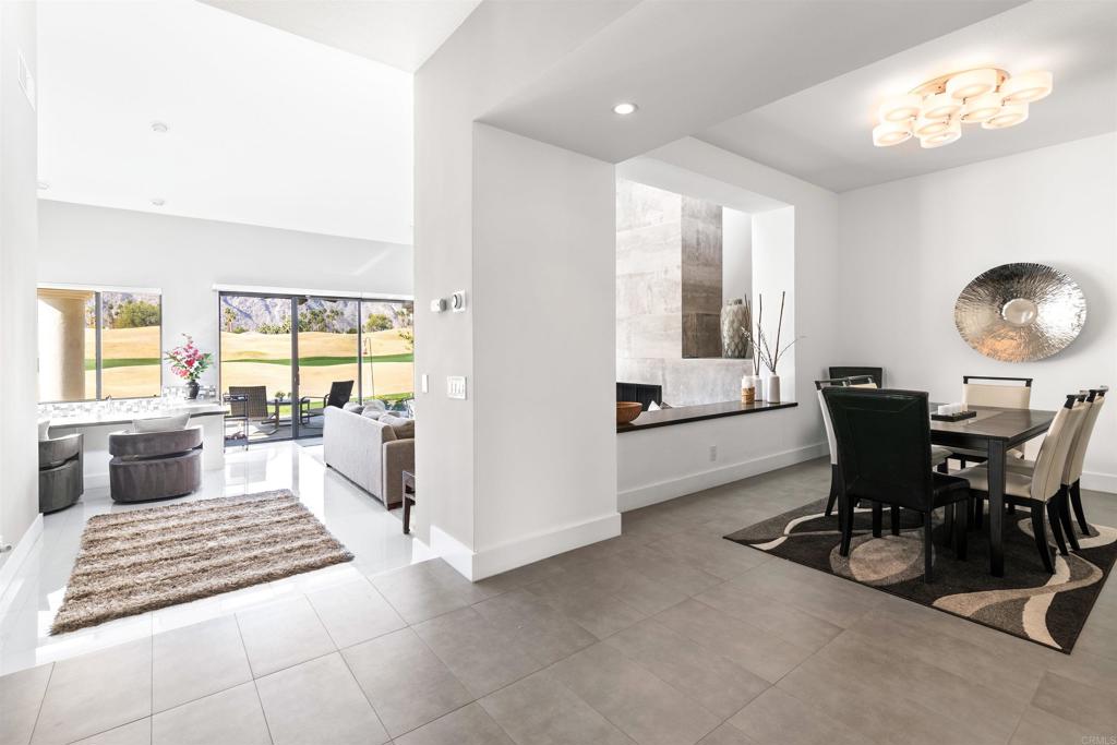 54877 Inverness Way La Quinta, CA 92253 - Photo 9 of 60 a living room with furniture and a large window