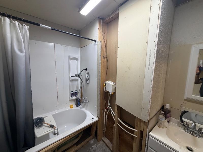 9300 Johns Road Alvarado, TX 76009 - Photo 30 of 40 a bathroom with a sink and a mirror