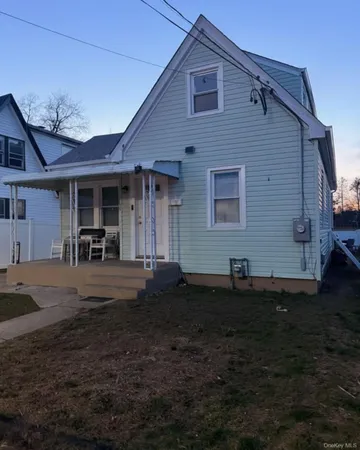 a front view of a house with yard
