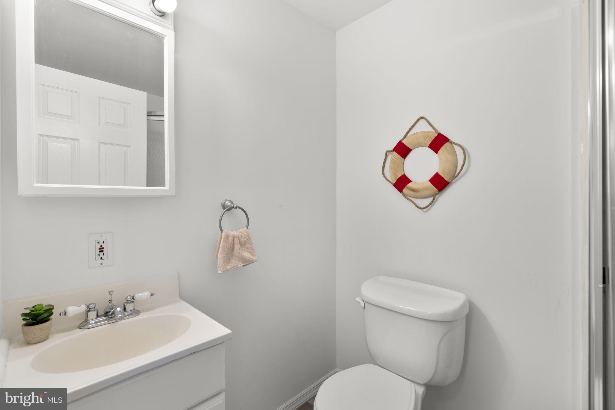 25 Leeland Road Edgewater, MD 21037 - Photo 26 of 48 a bathroom with a toilet sink and mirror