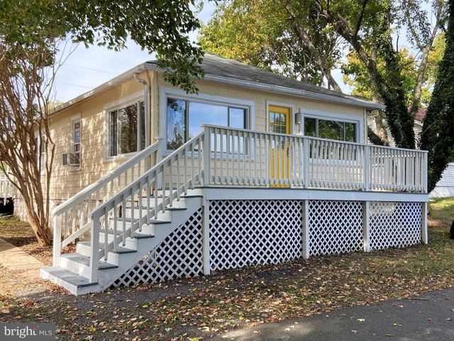 a front view of a house with a fence