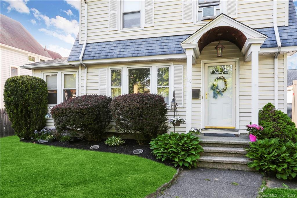 116 Old Spring Road Fairfield, CT 06824 - Photo 1 of 1 a front view of a house with garden