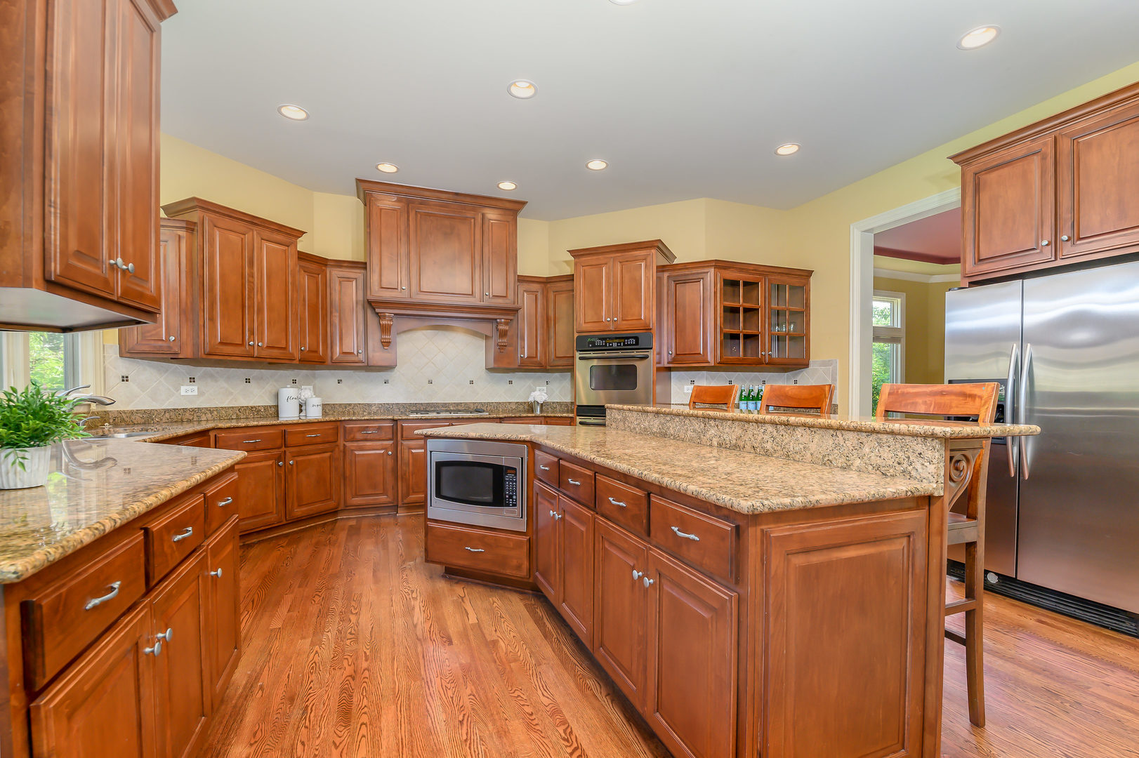 3416 Frankstowne Drive Naperville, IL 60565 - Photo 11 of 41 a kitchen with stainless steel appliances granite countertop a stove a sink dishwasher and a refrigerator