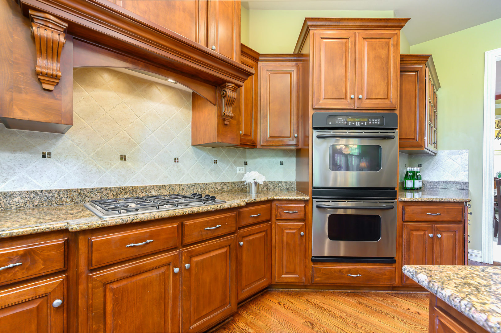 3416 Frankstowne Drive Naperville, IL 60565 - Photo 12 of 41 a kitchen with stainless steel appliances granite countertop a stove a sink and a microwave