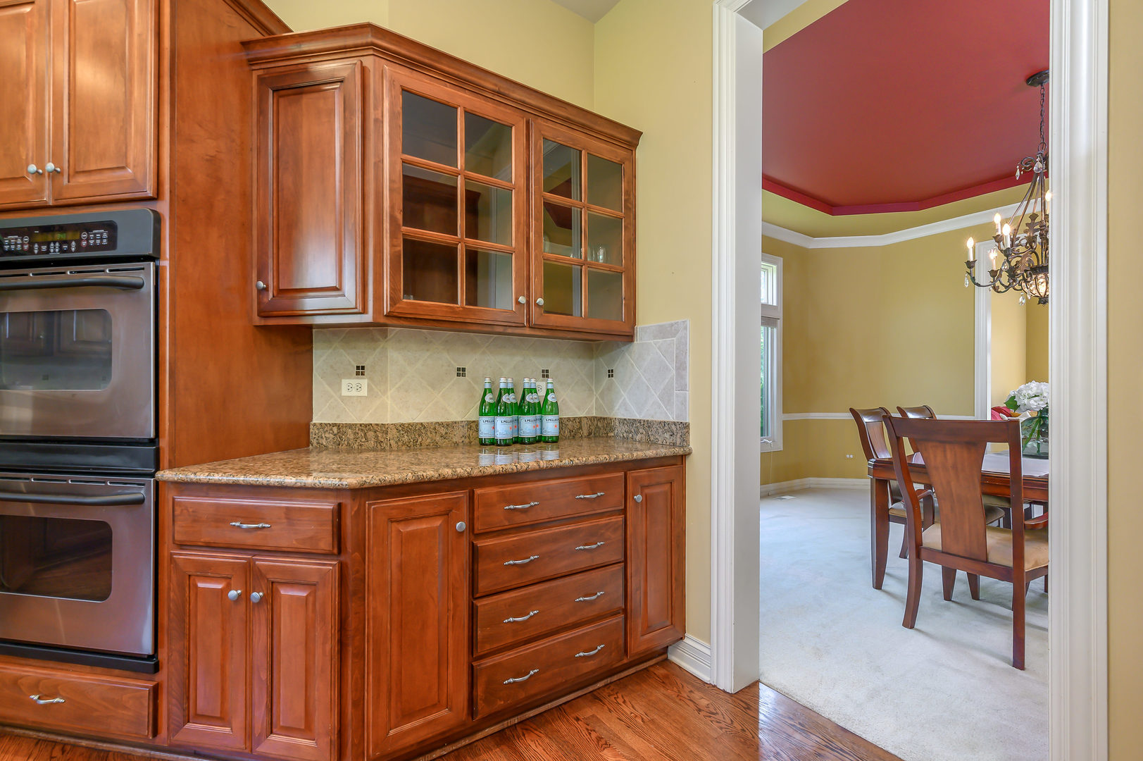 3416 Frankstowne Drive Naperville, IL 60565 - Photo 13 of 41 a kitchen with granite countertop cabinets and chairs