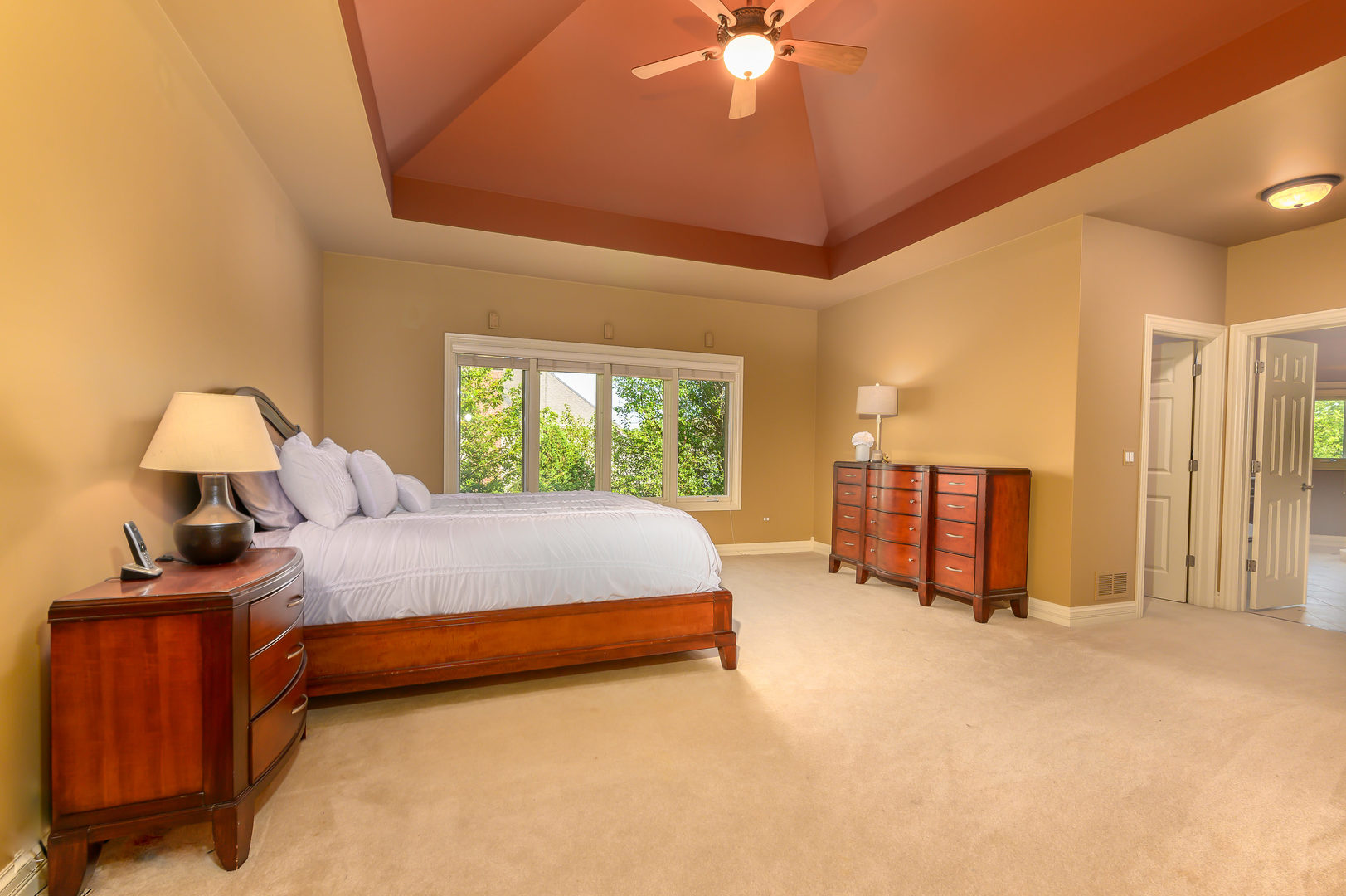 3416 Frankstowne Drive Naperville, IL 60565 - Photo 19 of 41 a bed room with a bed and a chandelier