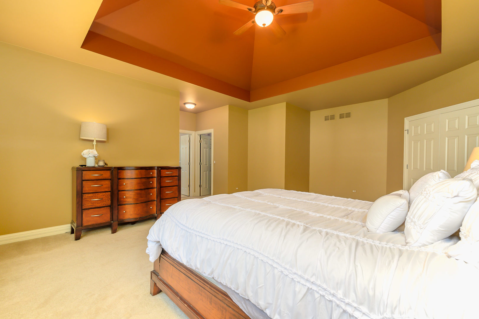 3416 Frankstowne Drive Naperville, IL 60565 - Photo 20 of 41 a spacious bedroom with a bed and a chandelier