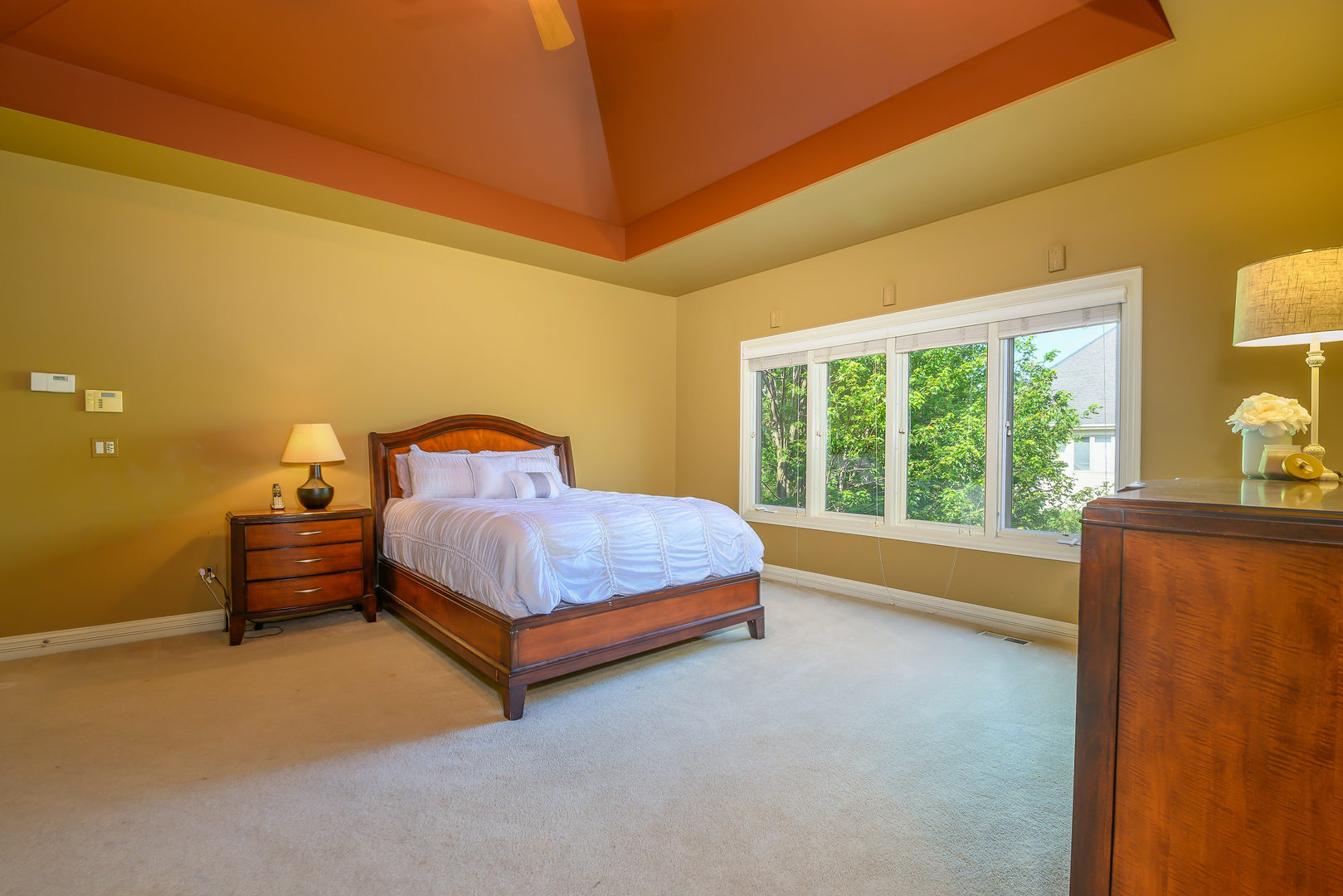 3416 Frankstowne Drive Naperville, IL 60565 - Photo 21 of 41 a bedroom with a bed lamp and a large window