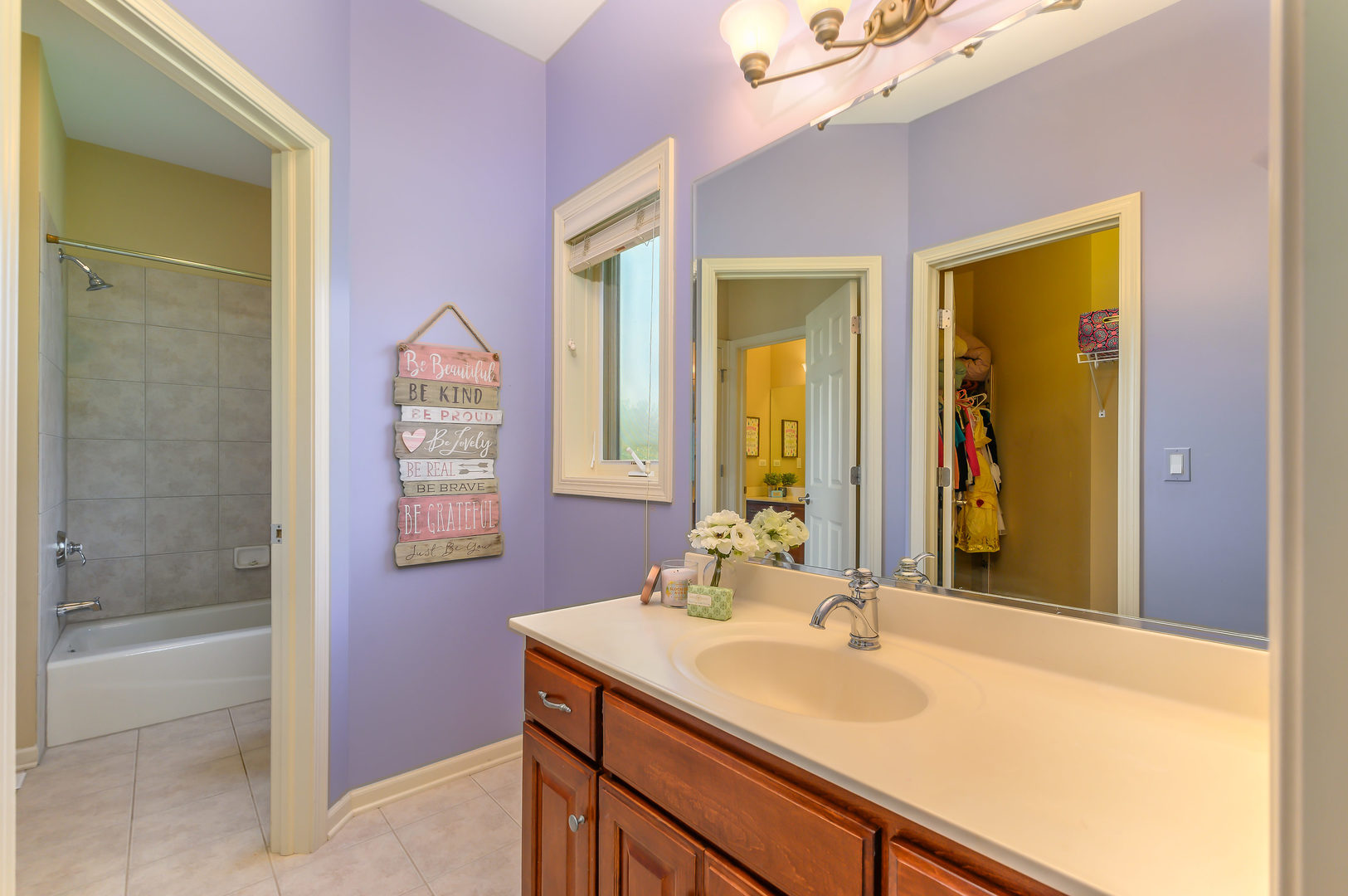 3416 Frankstowne Drive Naperville, IL 60565 - Photo 26 of 41 a bathroom with a sink and a mirror