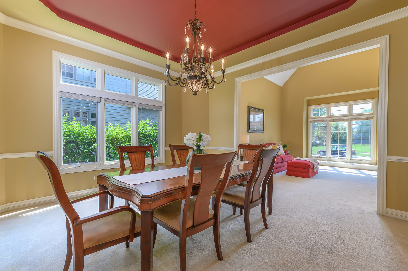 3416 Frankstowne Drive Naperville, IL 60565 - Photo 10 of 41 a dining room with furniture a chandelier and a rug