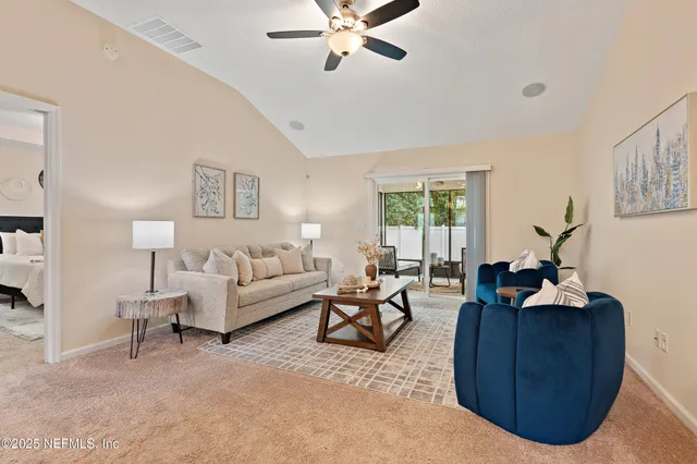 a living room with furniture and window
