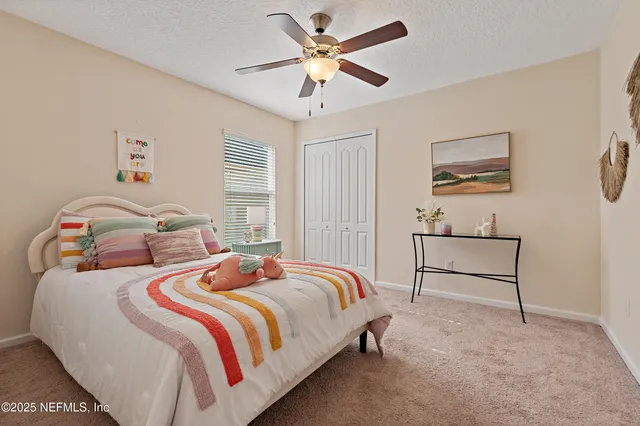 a bathroom with a granite countertop sink toilet and a mirror